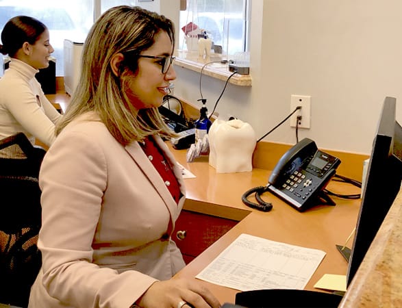 Our friendly staff sitting at the front desk